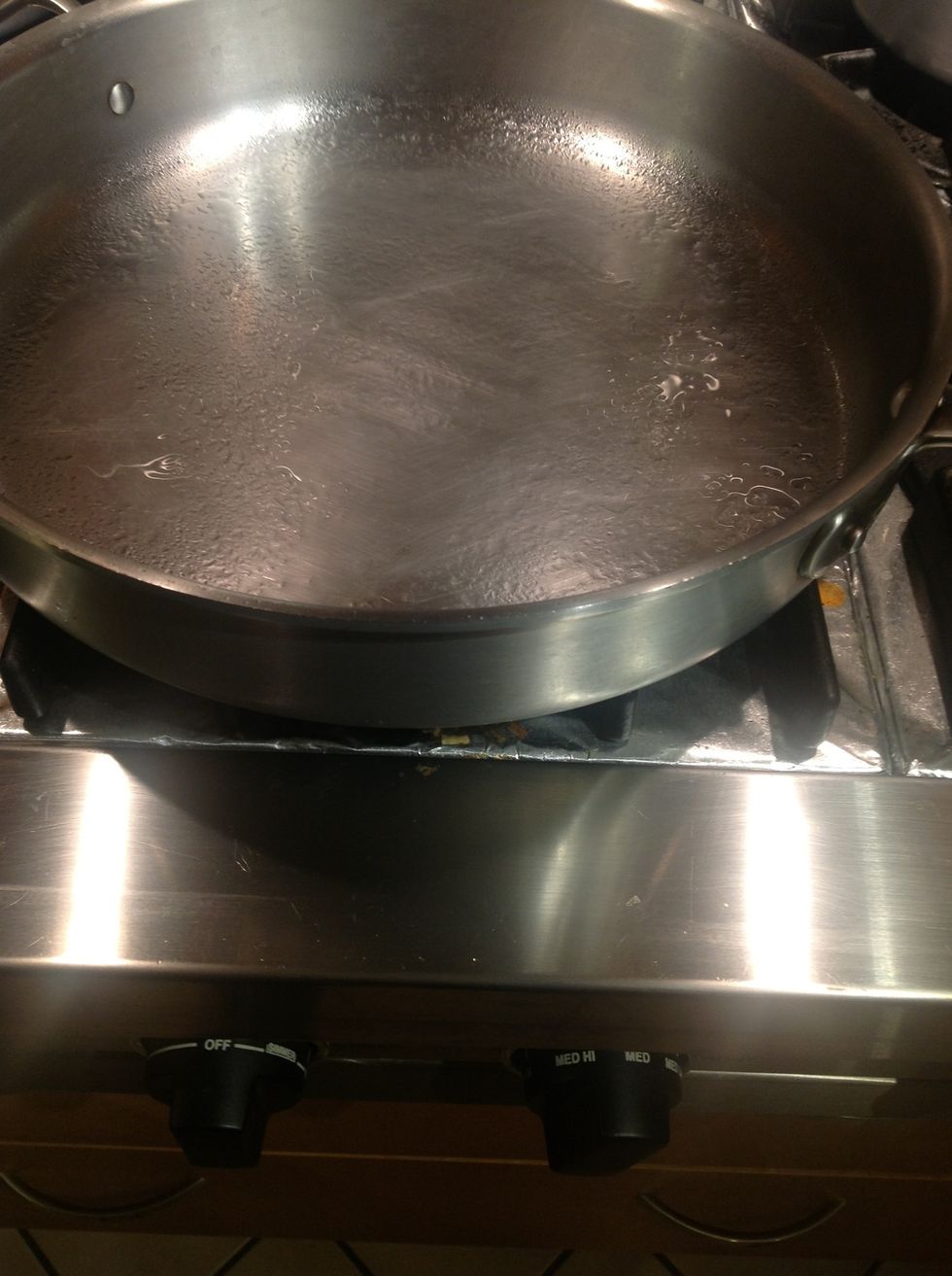 Spray saut\u00e9 pan with high heat cooking oil such as sunflower oil and pre-heat between medium and medium high.