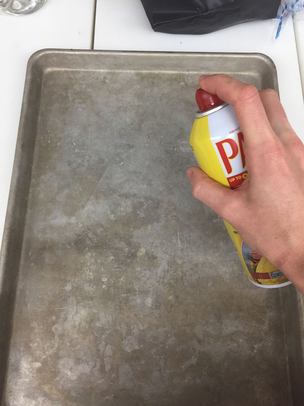 Spray sheet pan with nonstick spray.