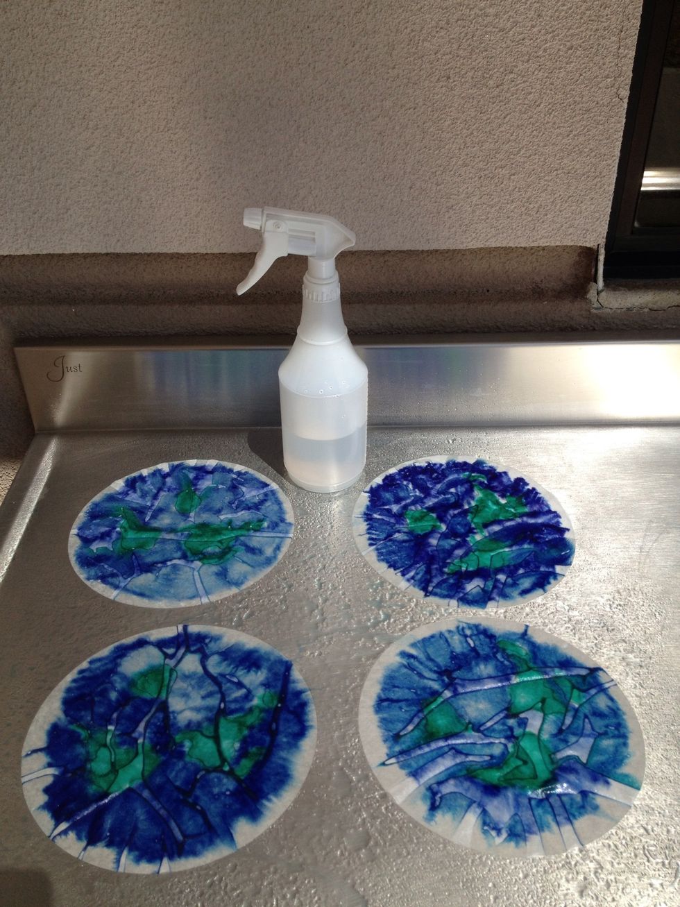 Spray the filters lightly and watch the effects begin. You can do this on a baking sheet, if you don't have a stainless steel work table like my Kindergarten has.