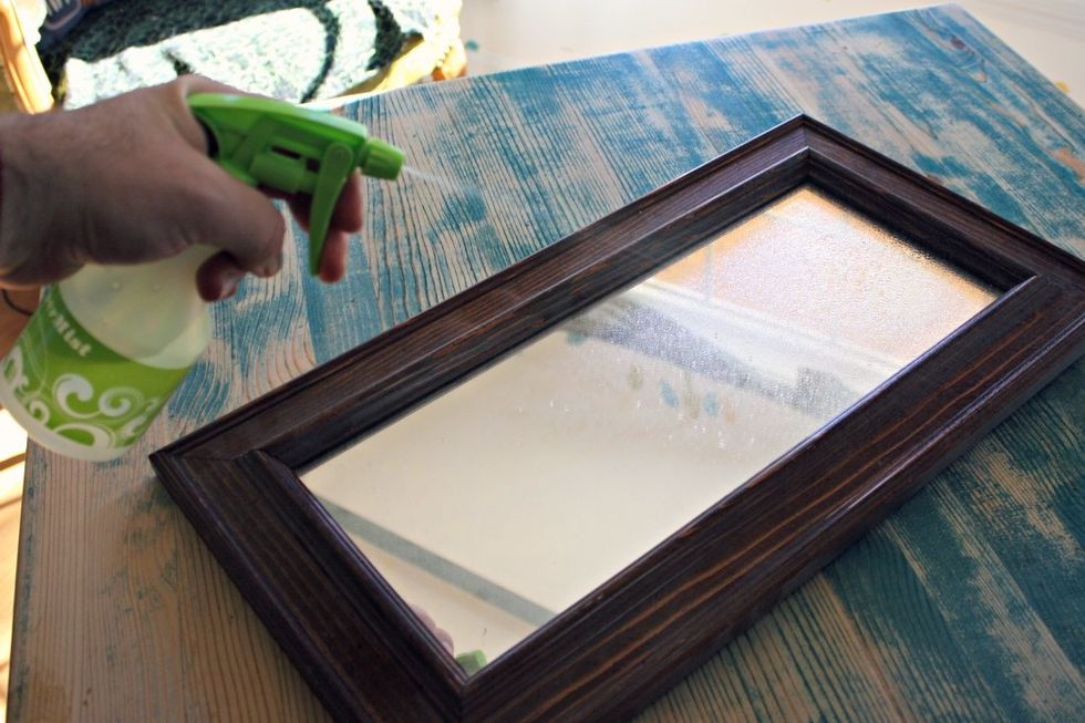 Spray the glass cleaner on and let it soak for 10-20 seconds. Then scrub, and wipe dry.