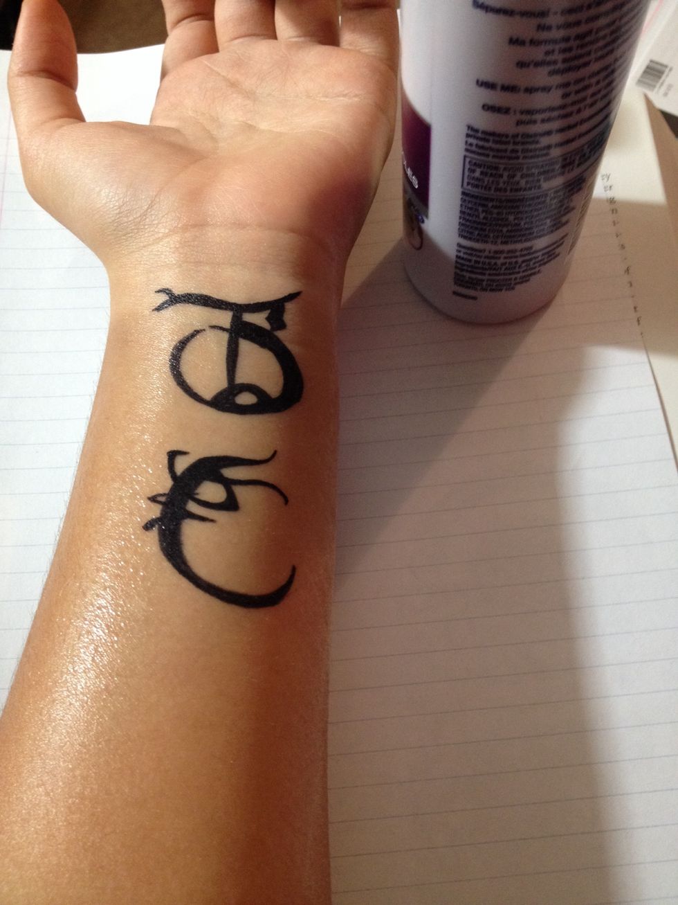 Spray the hairspray from about a foot away from the design. Make sure you get all of it, but be careful not to spray too much; it it might start to run.