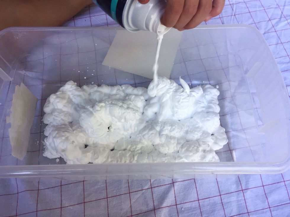 Spray the shaving cream into the container