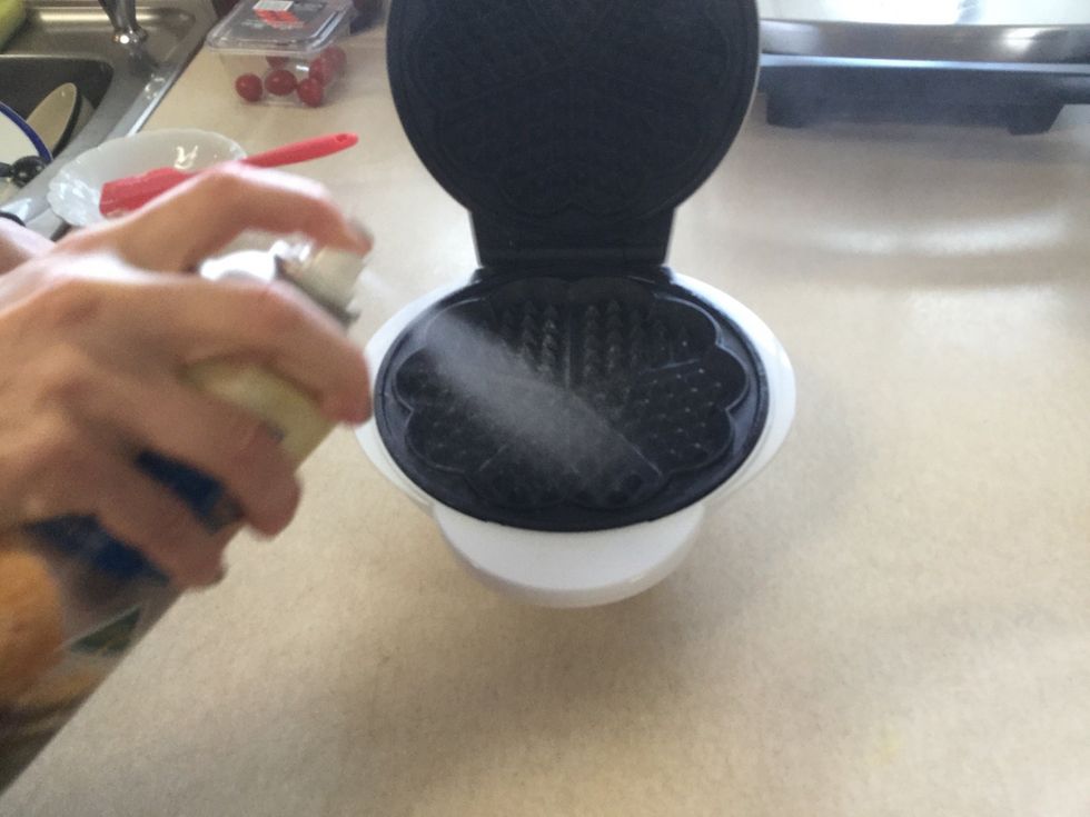 Spray the waffle iron with the nonstick cooking spray. You must only spray it once throughout the whole cooking process.