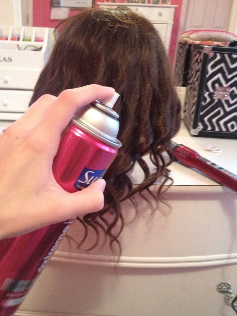 Spray this section with hair spray.