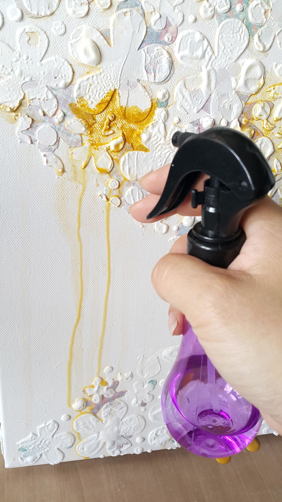 Spray water on the Gelatos color and let the color dip, repeat steps 6-7 to add more colors as you wish