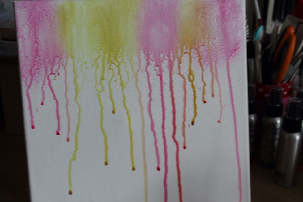 Spray water using a mister onto inked canvas.