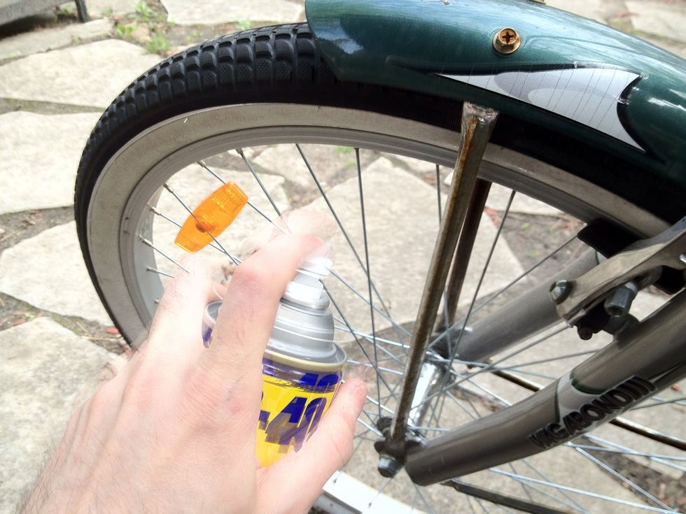 Spray WD40 generously onto rusty surface of chrome/metal.
