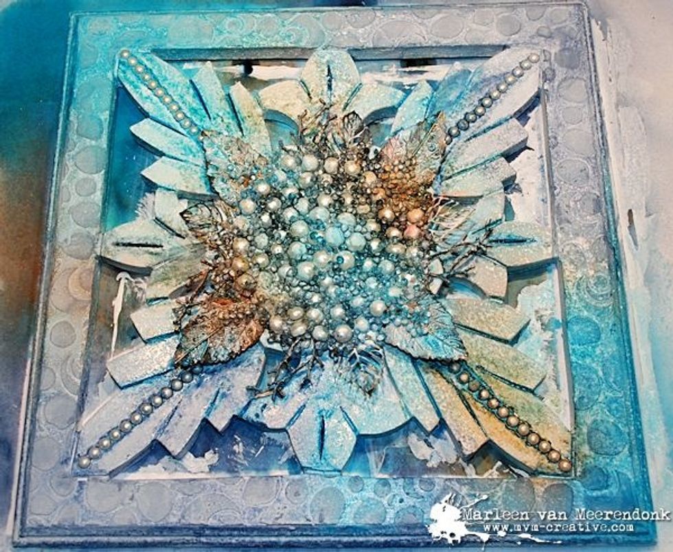 Spray with a little water and the inky wooden panel gets spots.