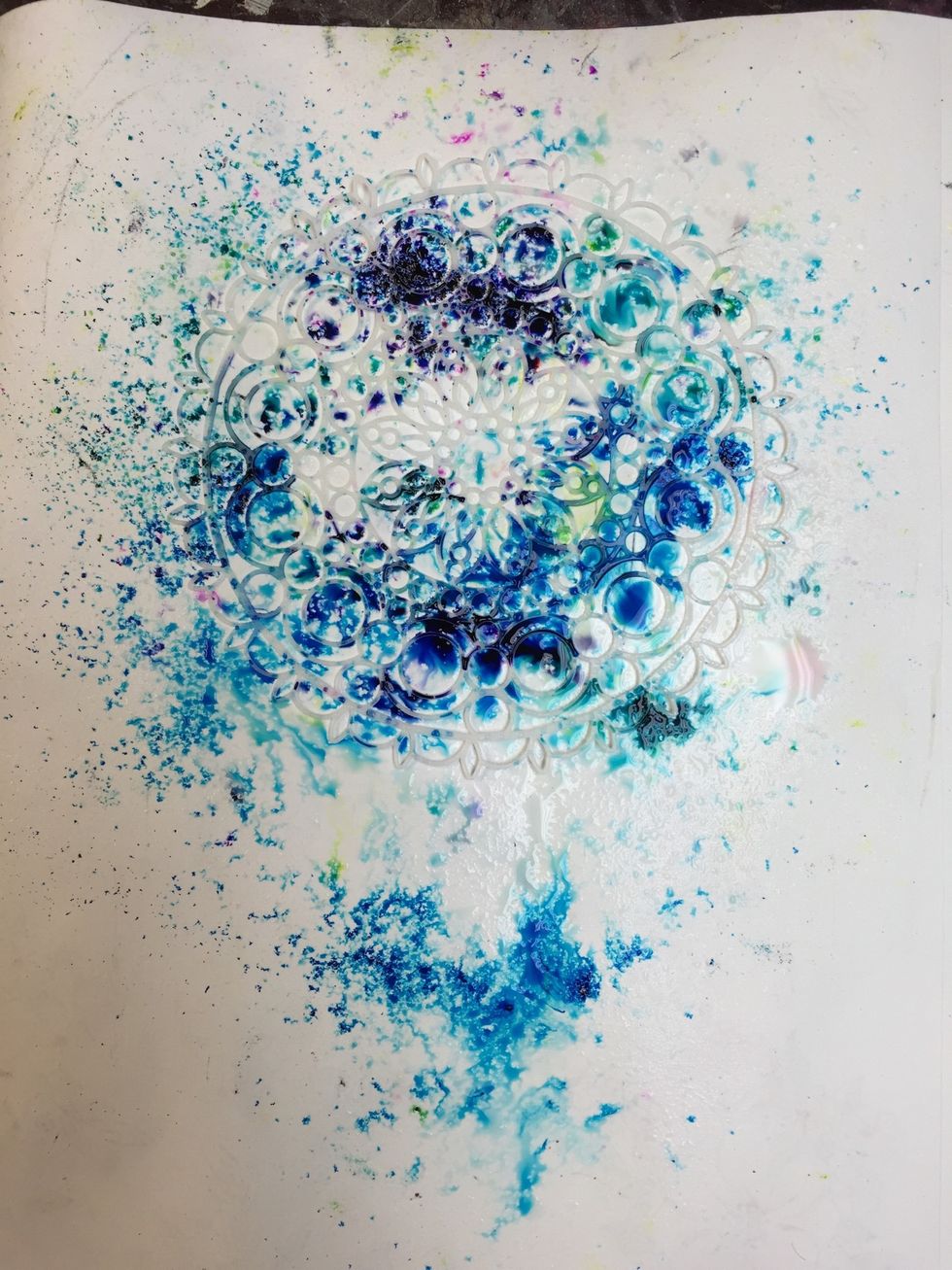 Spray with a water bottle then flip your stencil to stamp the design on your paper. As many times as you would like