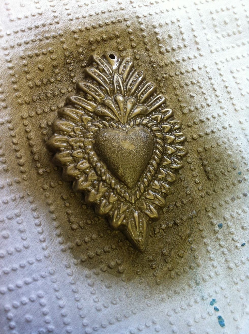 Spray with gold paint