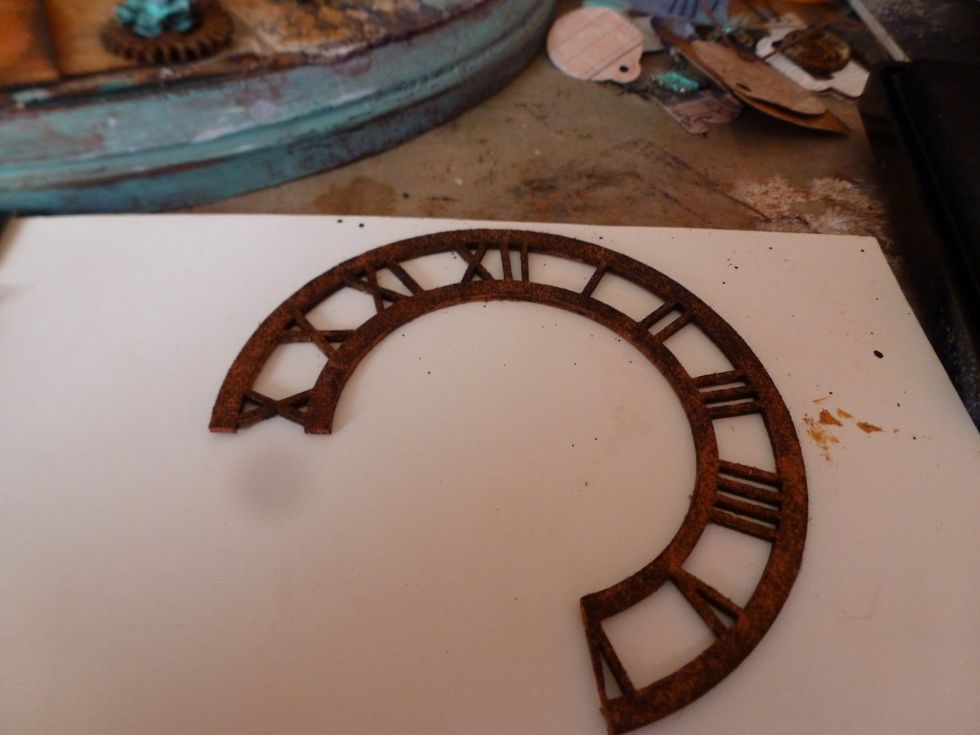 Sprayed the chipboard clock and the TH rosette trim with Lindy's Stampgang Cattail Copper Brown. Let dry.