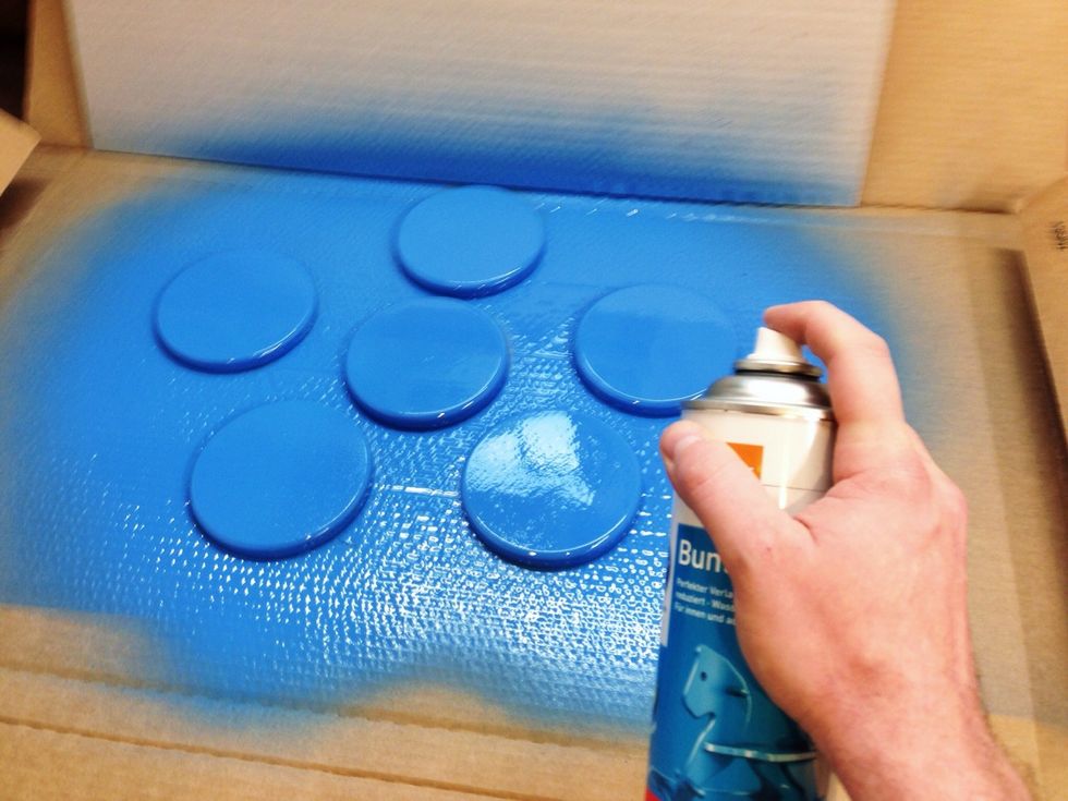Spraypaint the coasters once before you add them to the doors.