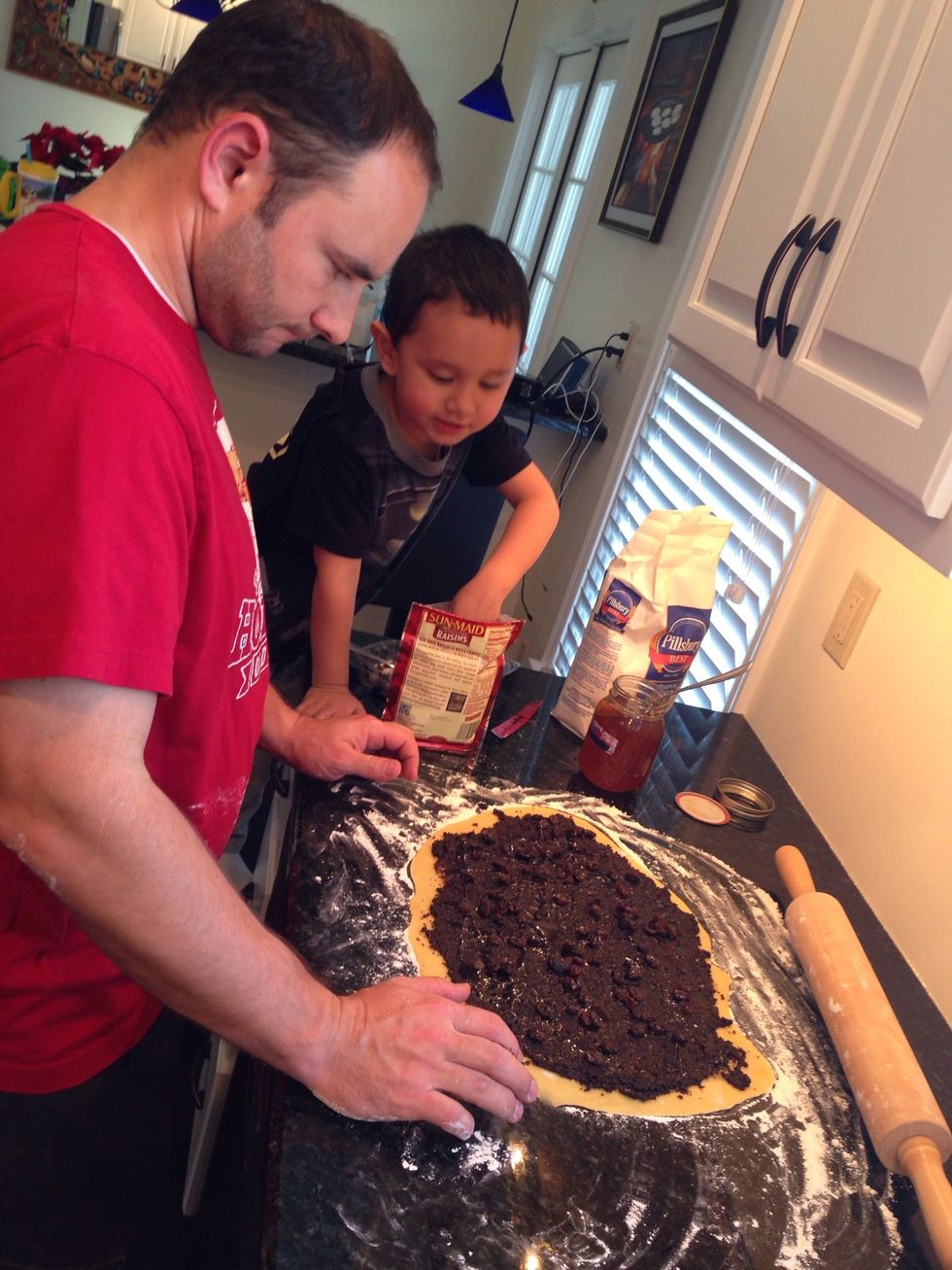 Spread 10 oz. of poppy seed filling   Sprinkle a handful of raisins. Drizzle honey. At least 4 tablespoons.