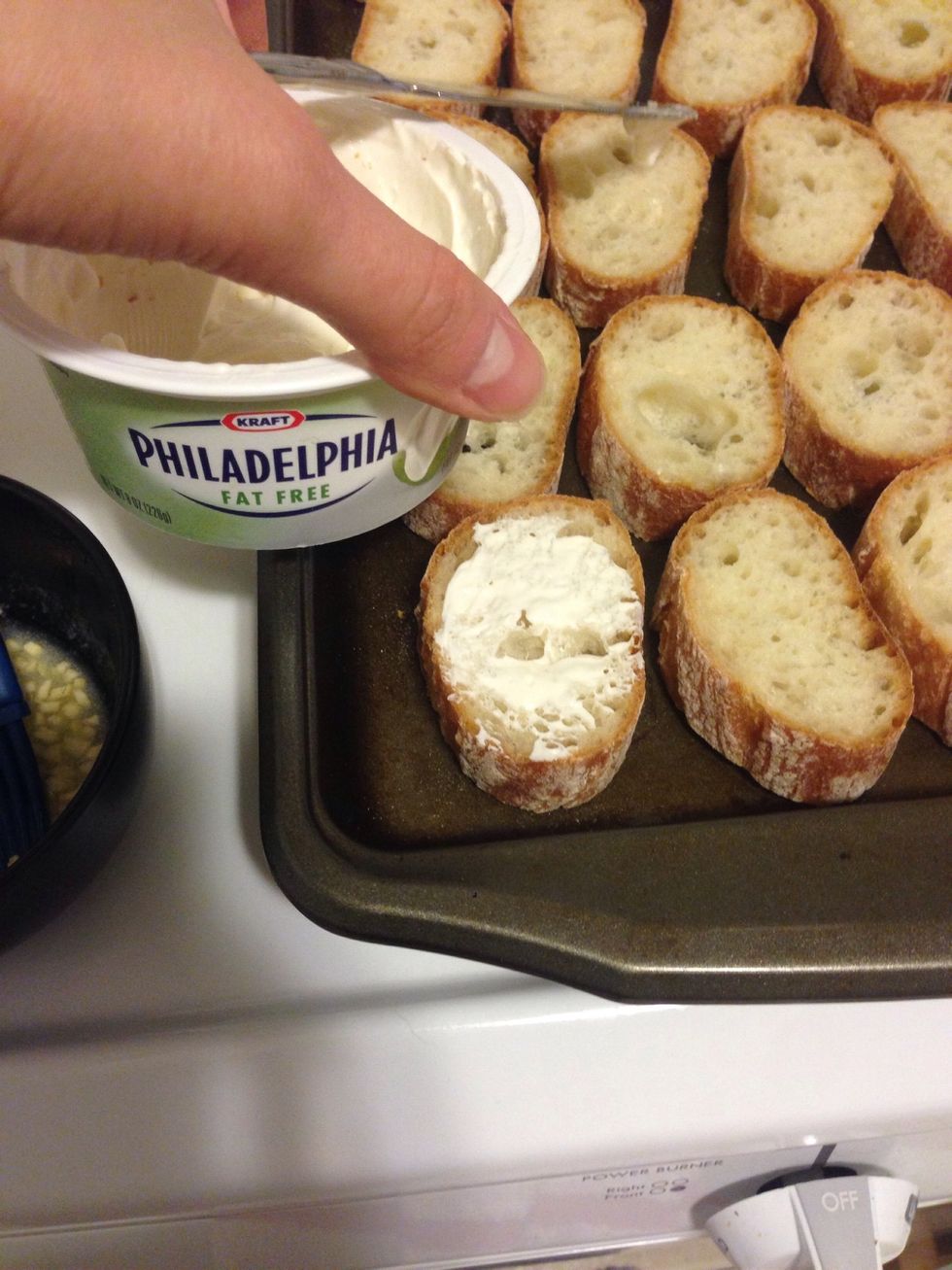 Spread a light layer of cream cheese on the bread slices. I used about 1 tbsp per baquette. I used the fat free.