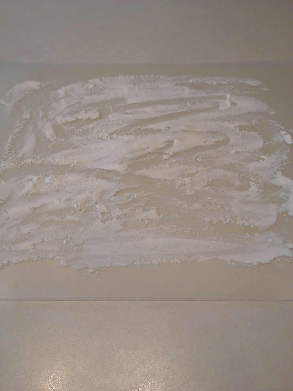 Spread a little bit of flour on a clean surface.