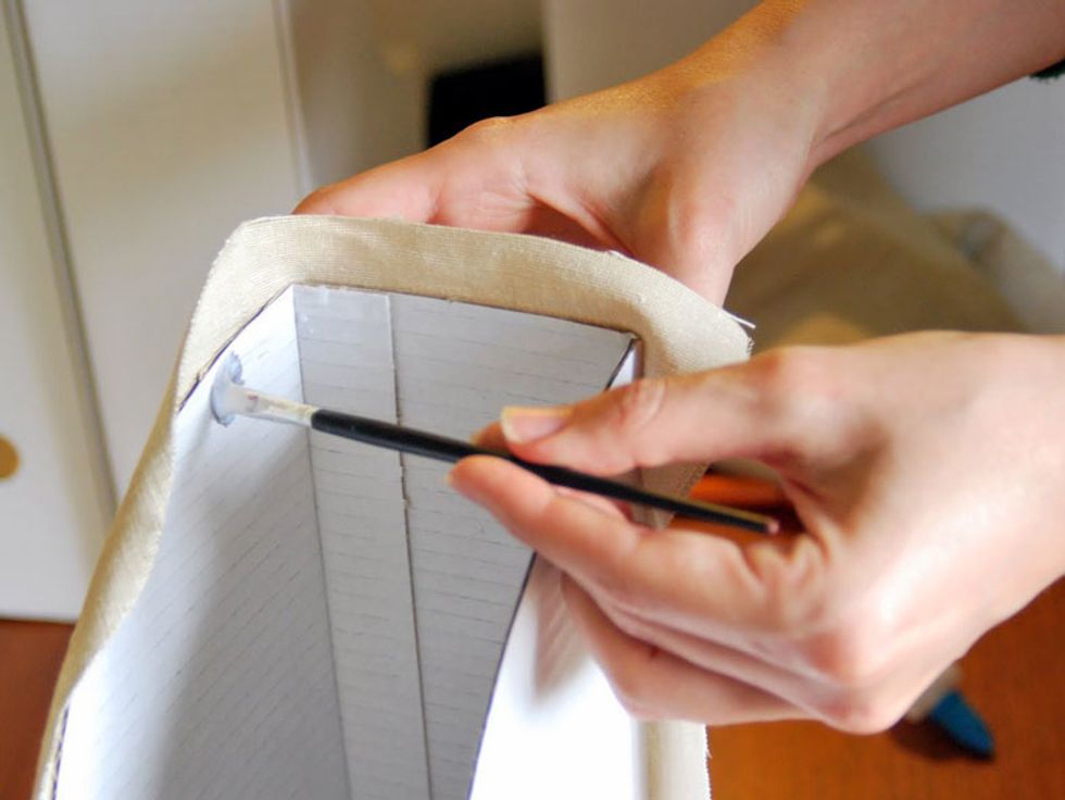 Spread a little glue on the inside of the folder for gluing margins.