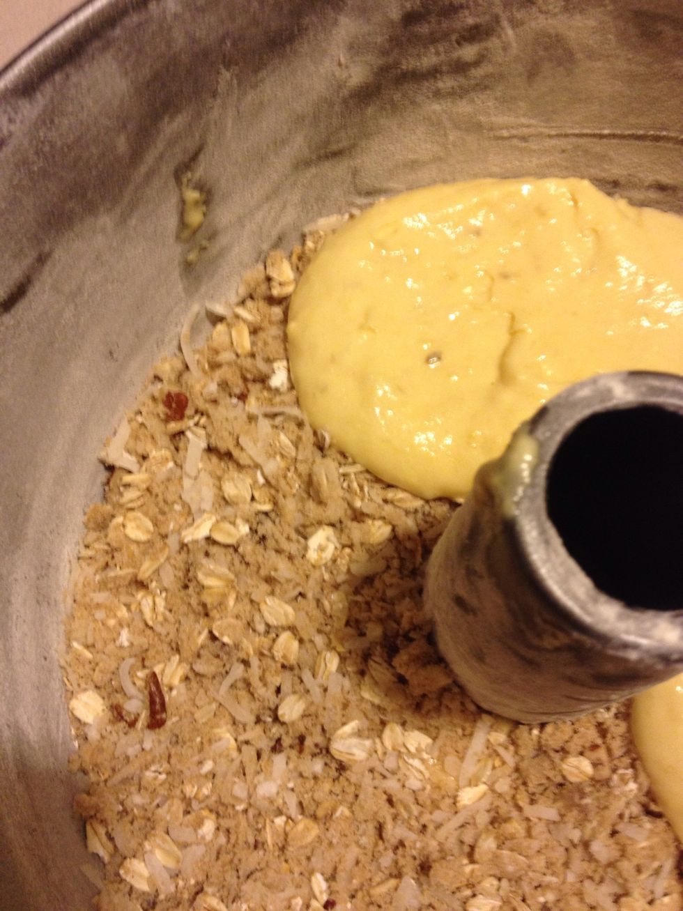 Spread a second thin layer of batter over the oat layer.