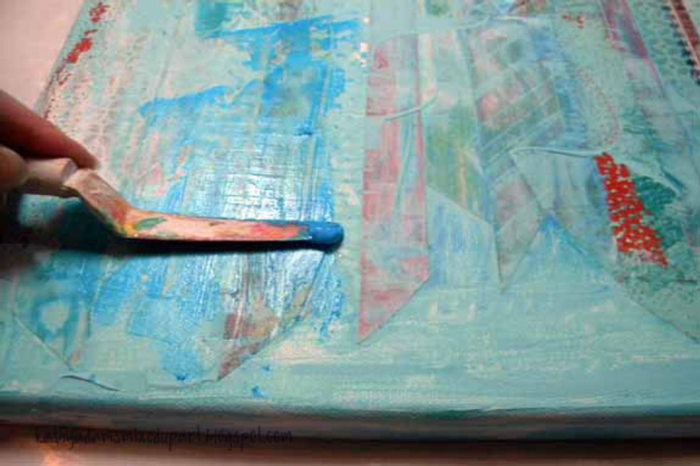 Spread Aloha Sorbet liberally onto the canvas with a palette knife and let it dry.  The paint is transparent so you will see the layers underneath.