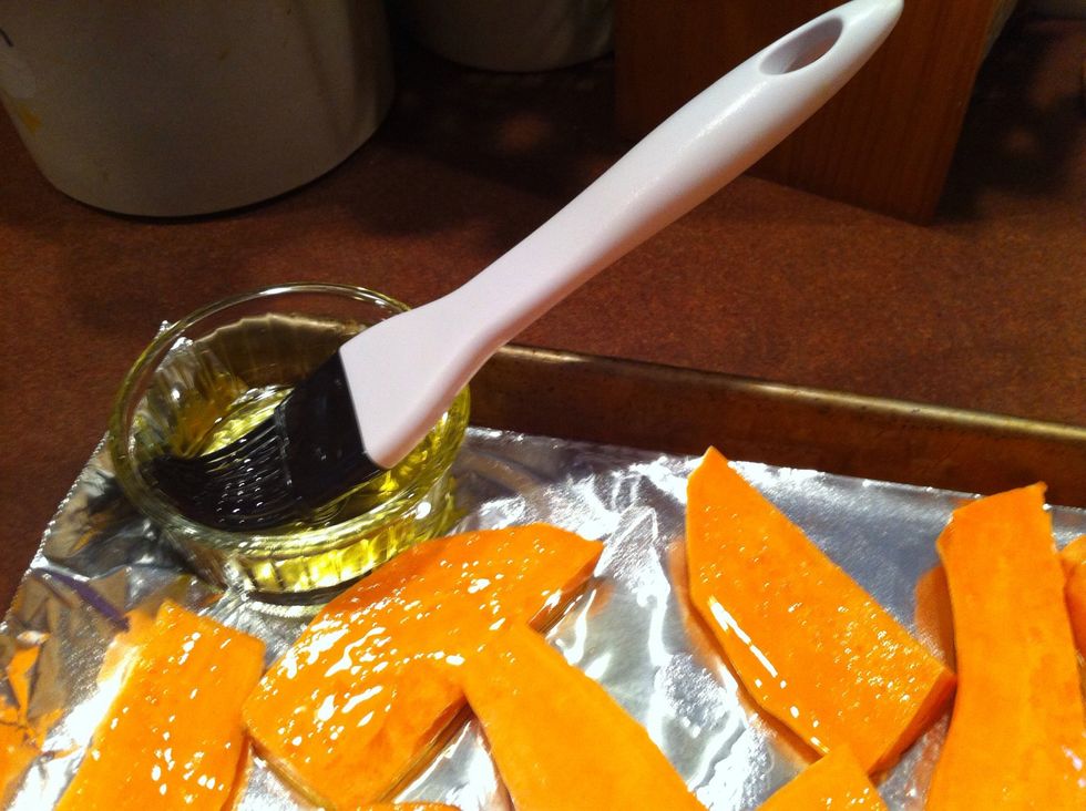 Spread aluminum foil on baking sheet. Spray with cooking oil. Arrange sliced sweet potatoes. Brush them with olive oil.