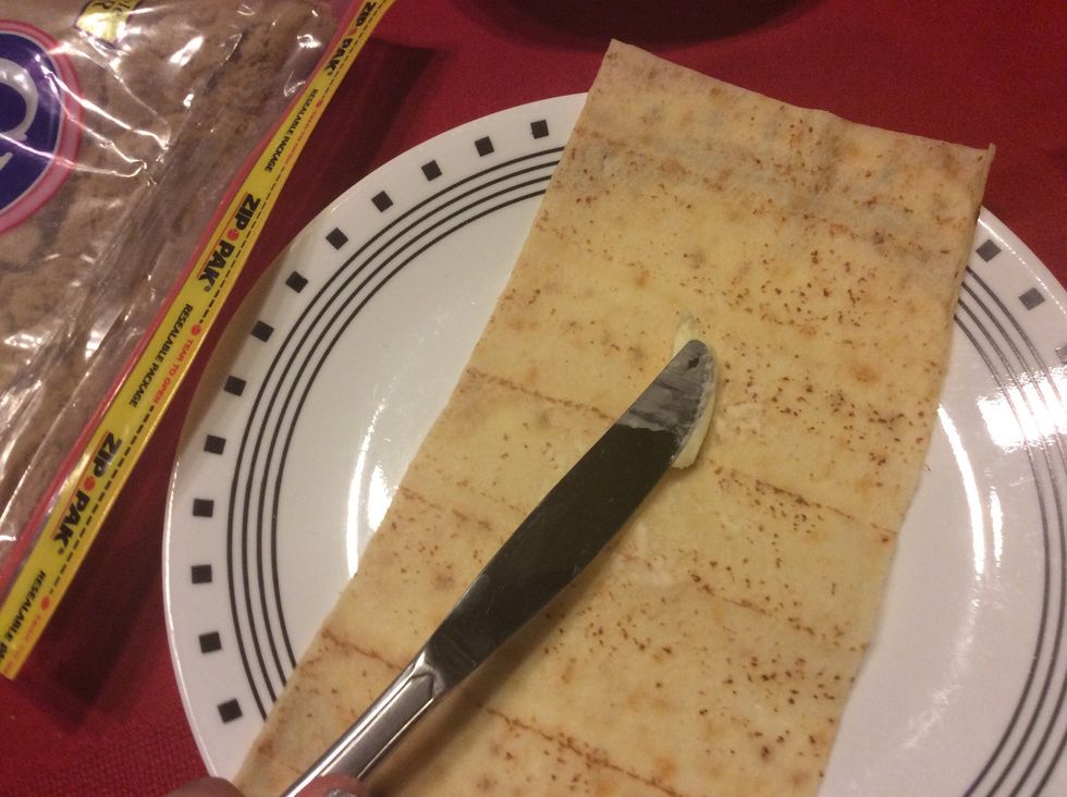Spread butter across cooked lefse once cooled.