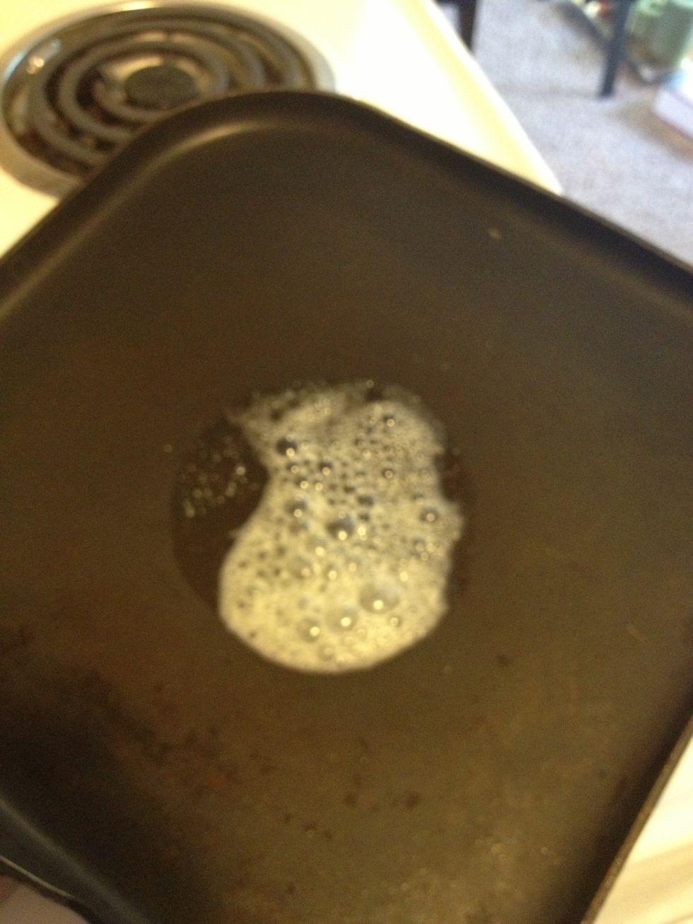 Spread butter on pan