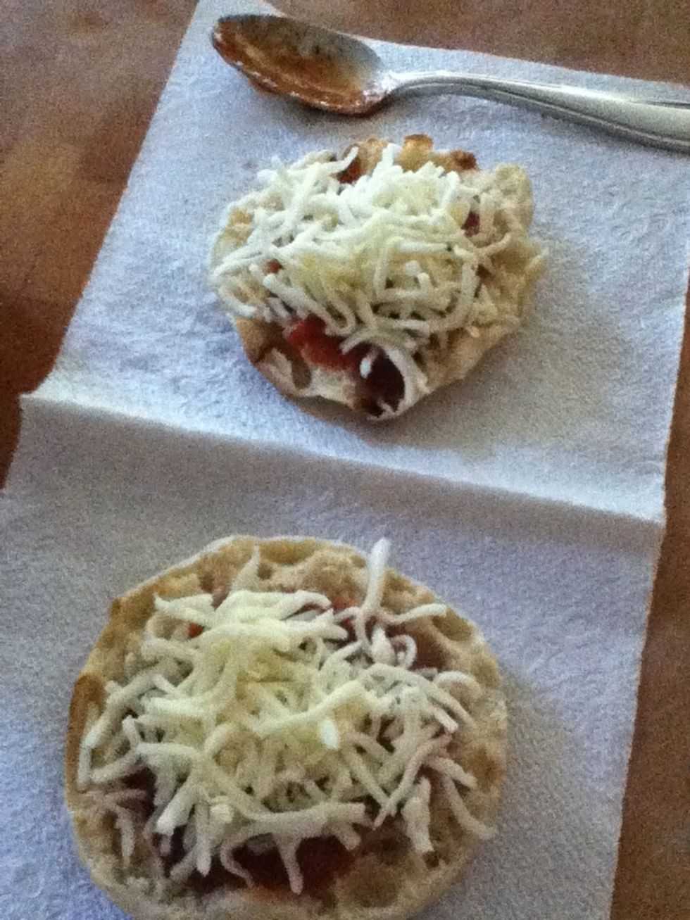 Spread Cheese on the English muffin .