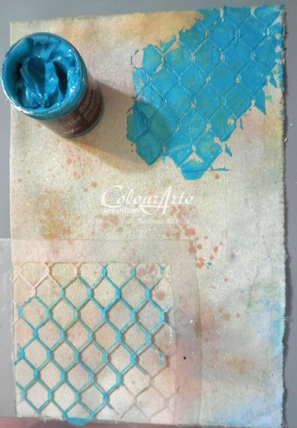 Spread ColourArte Guatamalan Green Radiant Gel dimensional paint through the Sin City Stamps chicken wire stencil in three places. Allow to dry.