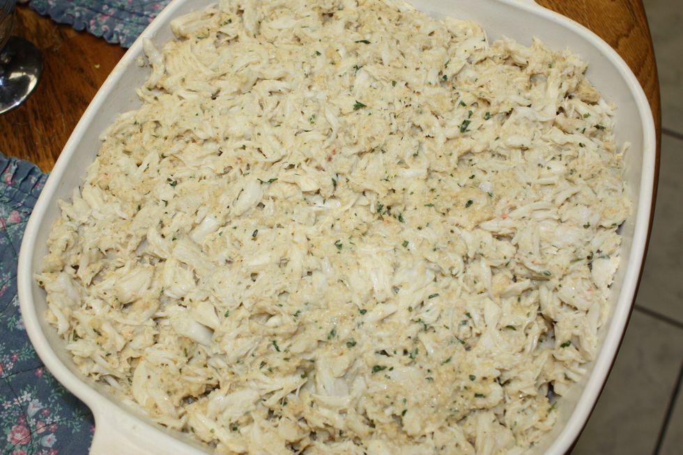Spread crab into casserole dish.