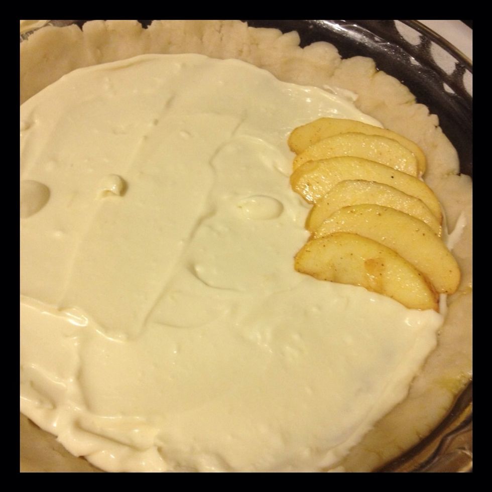 Spread cream cheese filling into the dish. Start layering your apples. I used a circular design. I had to eat a few slices too!