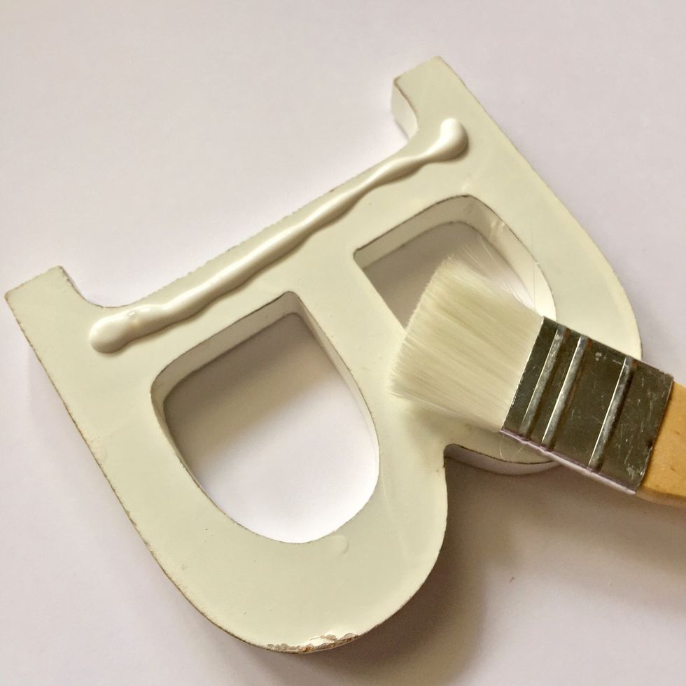 Spread decoupage glue with the brush.