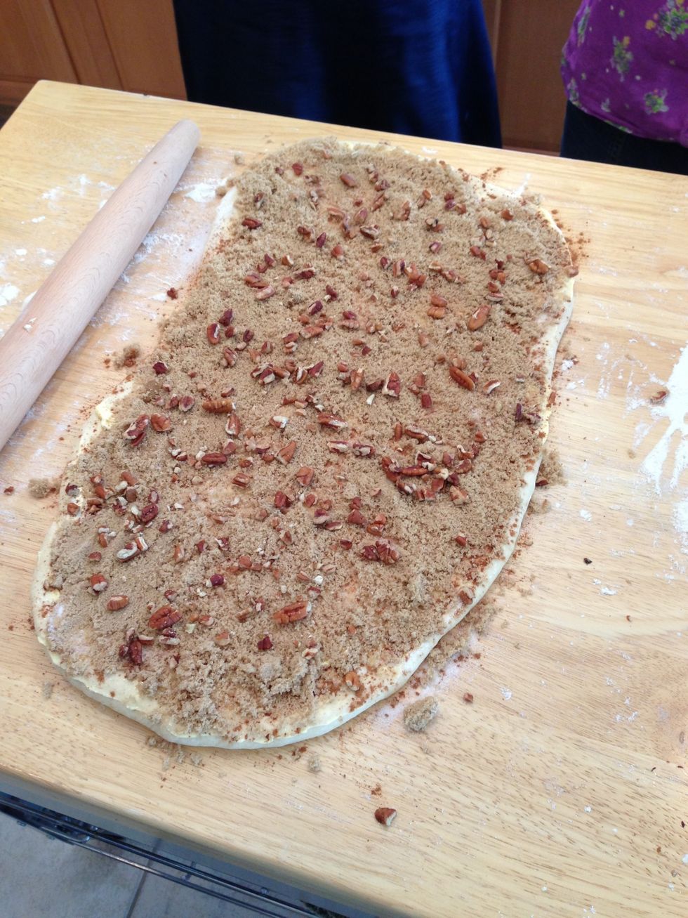 Spread dough with butter sugar cinnamon brown sugar and then pecans