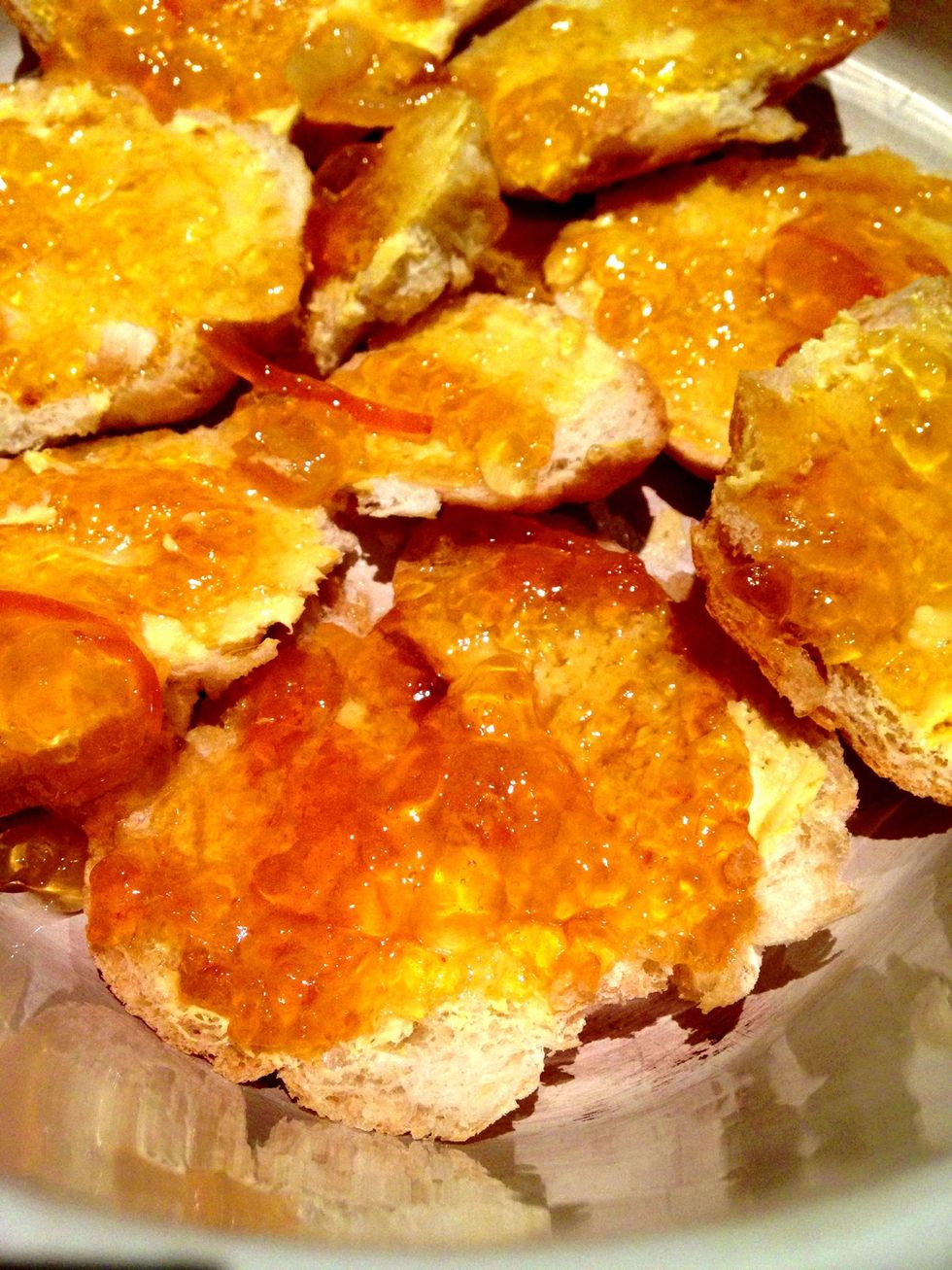 Spread each slice with butter and then jam. For the bottom layer I used all the small odd shaped bread and apricot jam. The middle later was bottom crusts and Marmelade.