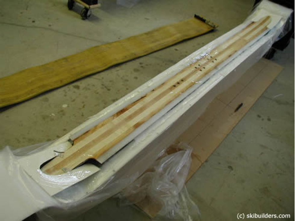 Spread epoxy on the core and put it on top of the composite material