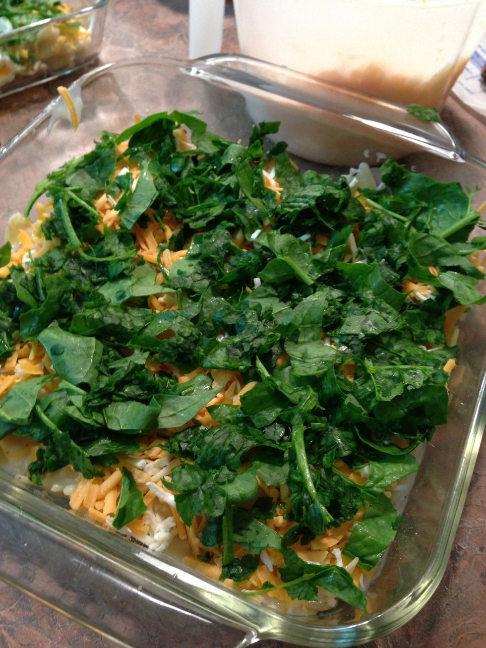 Spread evenly.  You could experiment by adding some finely chopped red and yellow bell peppers for color and flavor, & also onion!