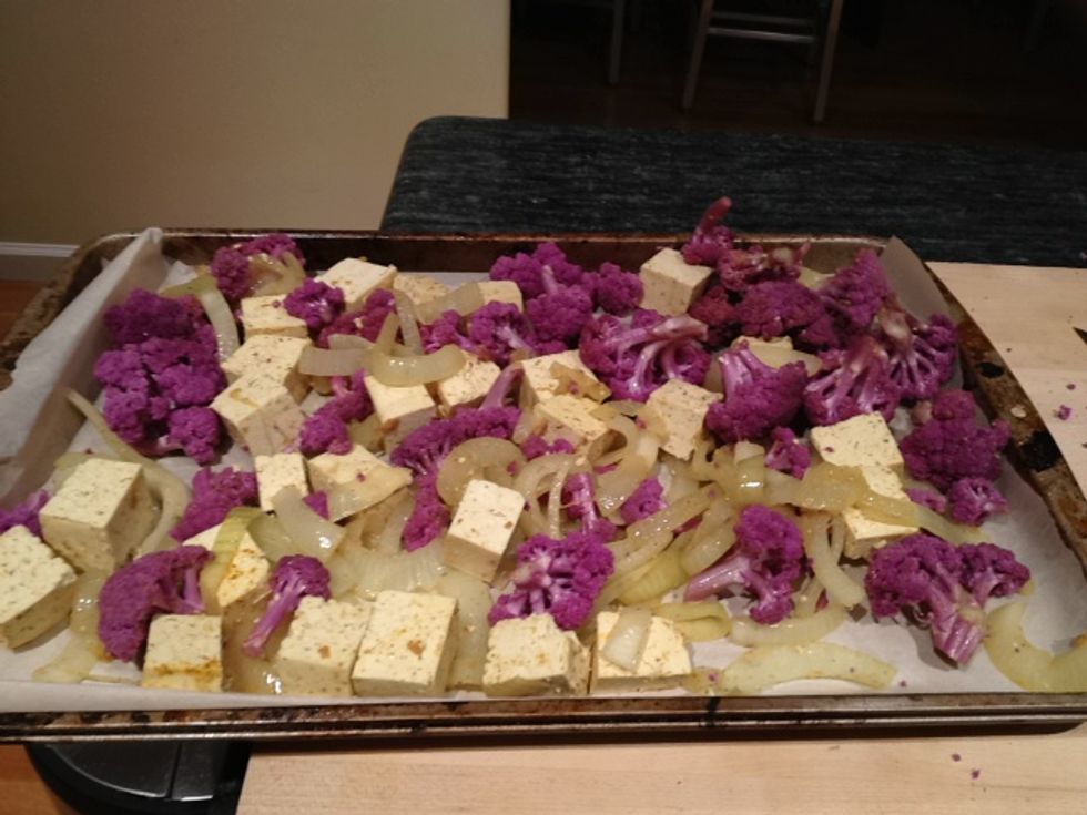 Spread everything onto a baking sheet prepared with parchment paper. I usually spray the paper and the top of the mixture with a bit of cooking spray. Make sure the mixture is evenly distributed.