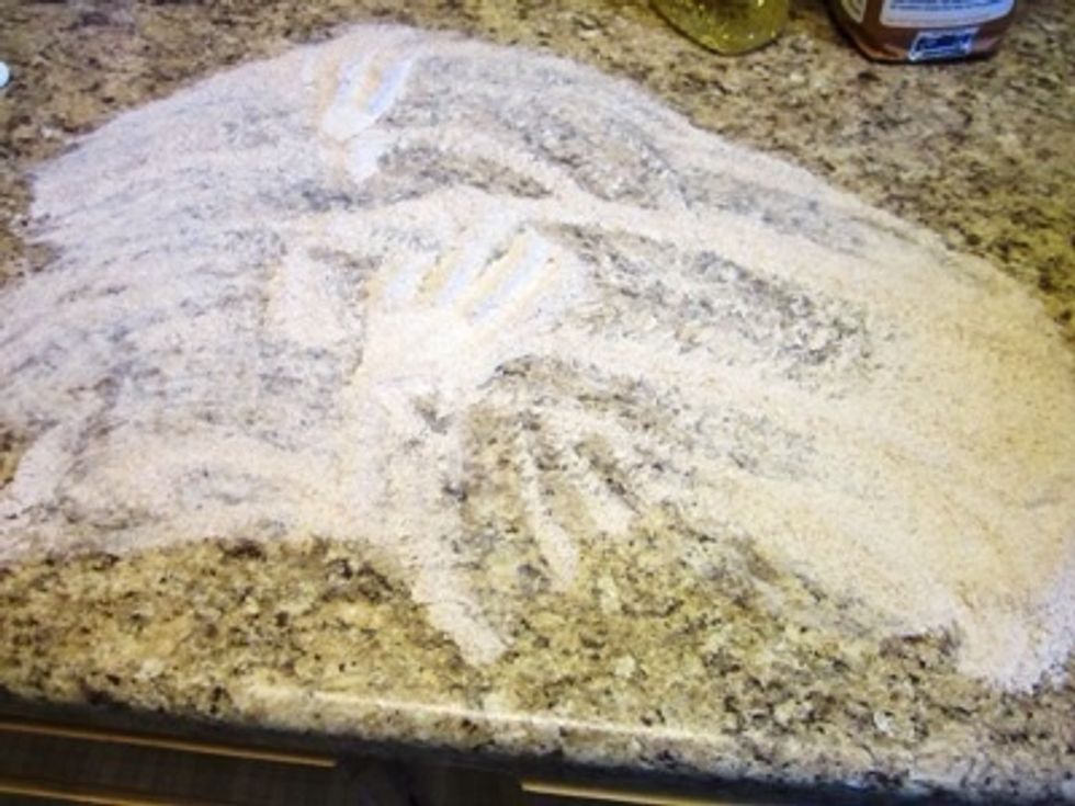 Spread flour on your countertop. This is where you will knead the bread dough and the flour helps keep it from sticking to the countertop.