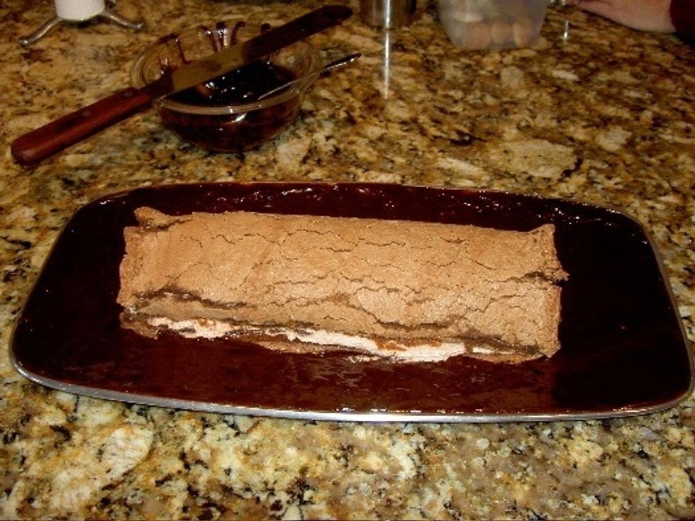 Spread frosting around the platter to create mud effect.