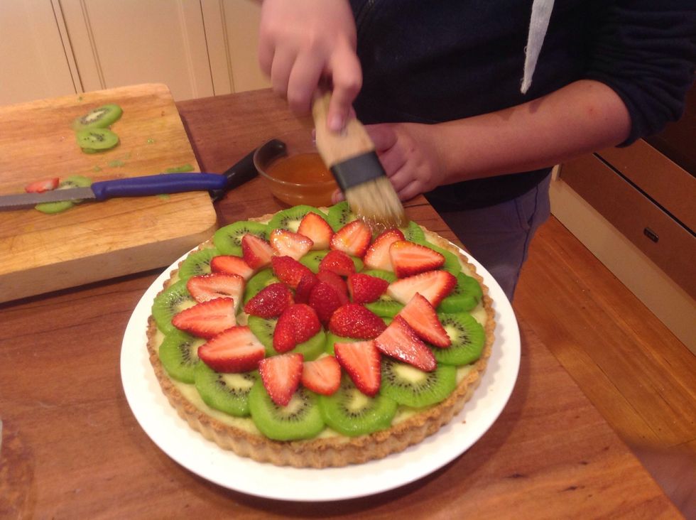 Spread glaze on top to make the flan nice and shiny