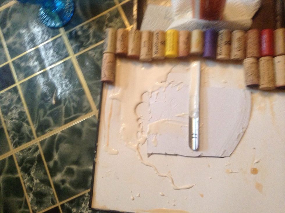 Spread glue evenly with a paint brush or crumber seen here.
