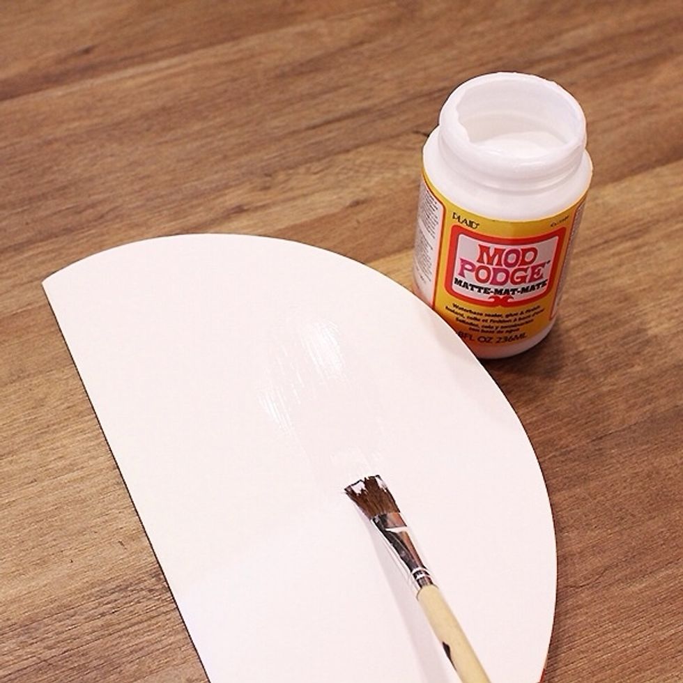 Spread glue thoroughly on each backside of the folded circle.
