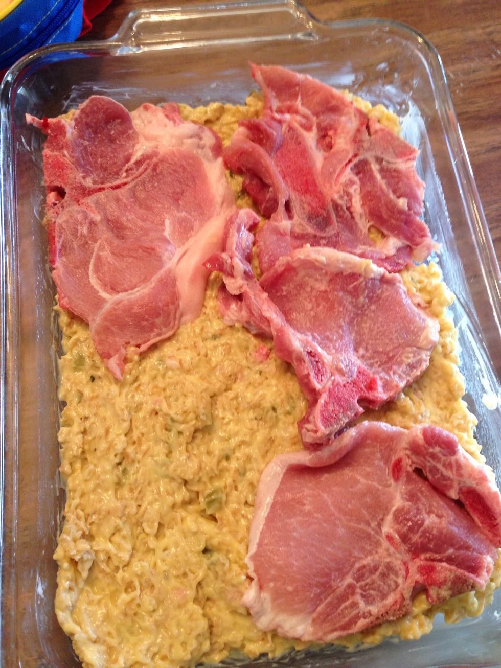 Spread in the dish and lay the chicken on top. (I recognize these are pork chops. I wanted to use what I had instead of pulling out more chicken. That's a tip for saving money!)