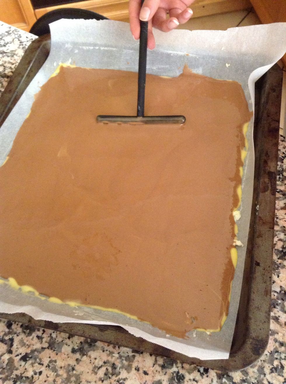 Spread it around with a spatula. Be careful not to ruin the pattern.