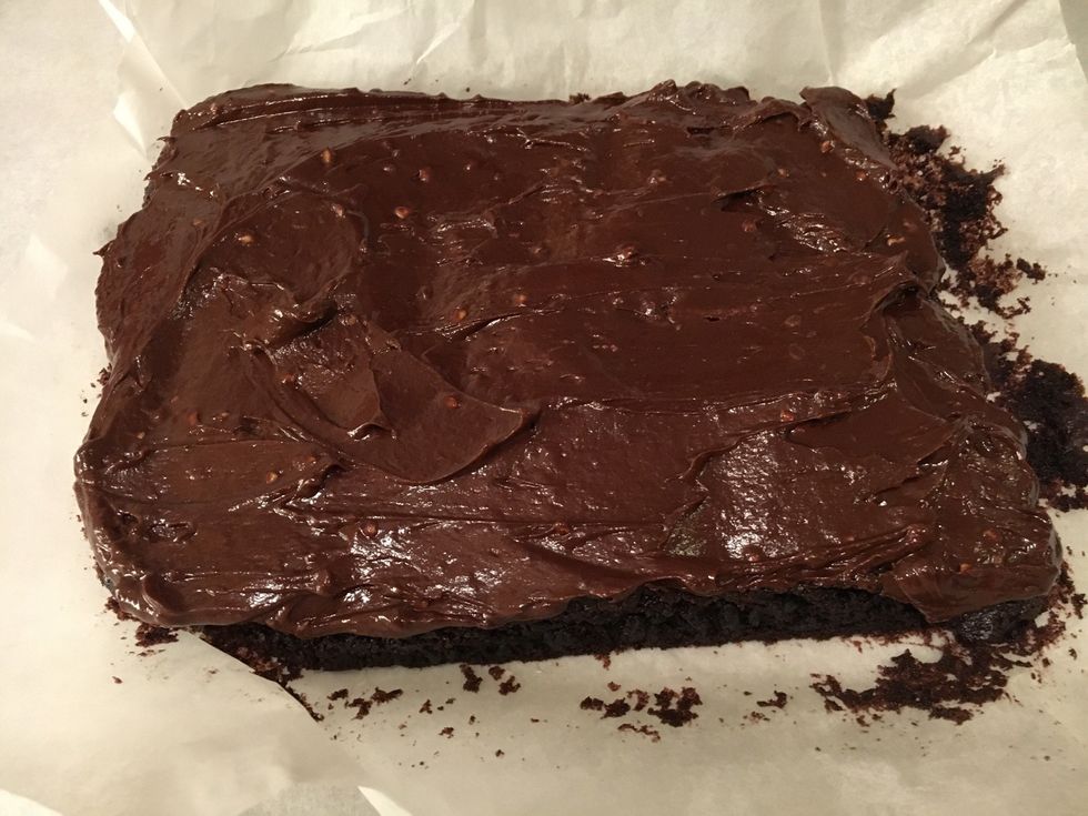Spread it evenly on top of the brownie.