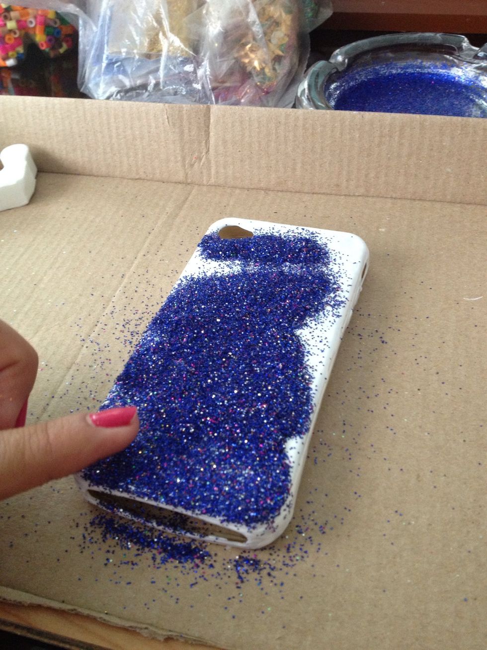 Spread it out with your finger (very softly).