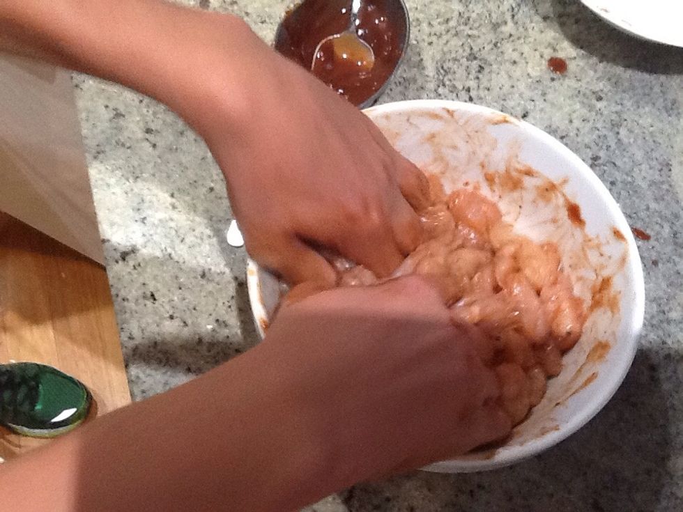 Spread it through the chicken then let It marinate for fifteen minutes.