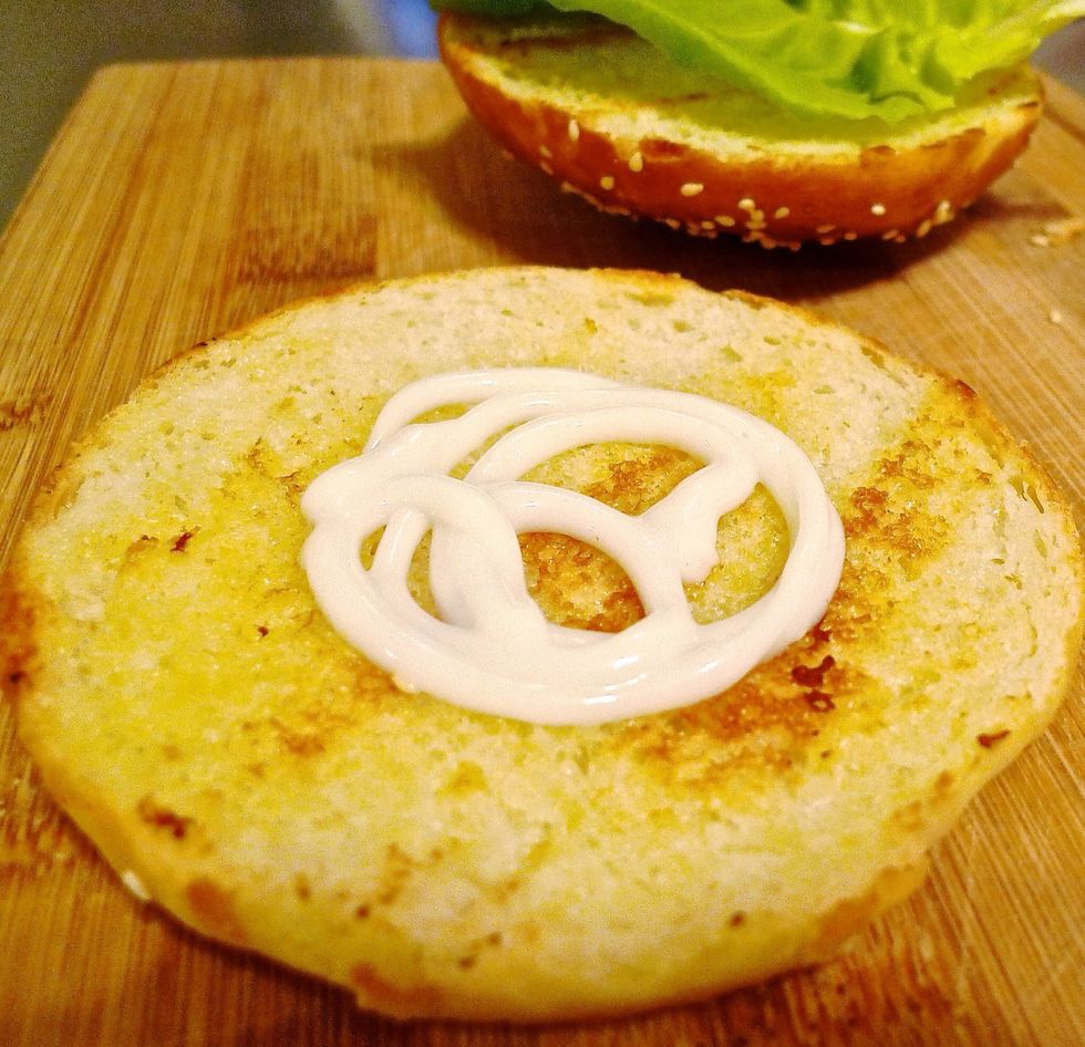 Spread just a thin layer of light mayonnaise on the bottom half.