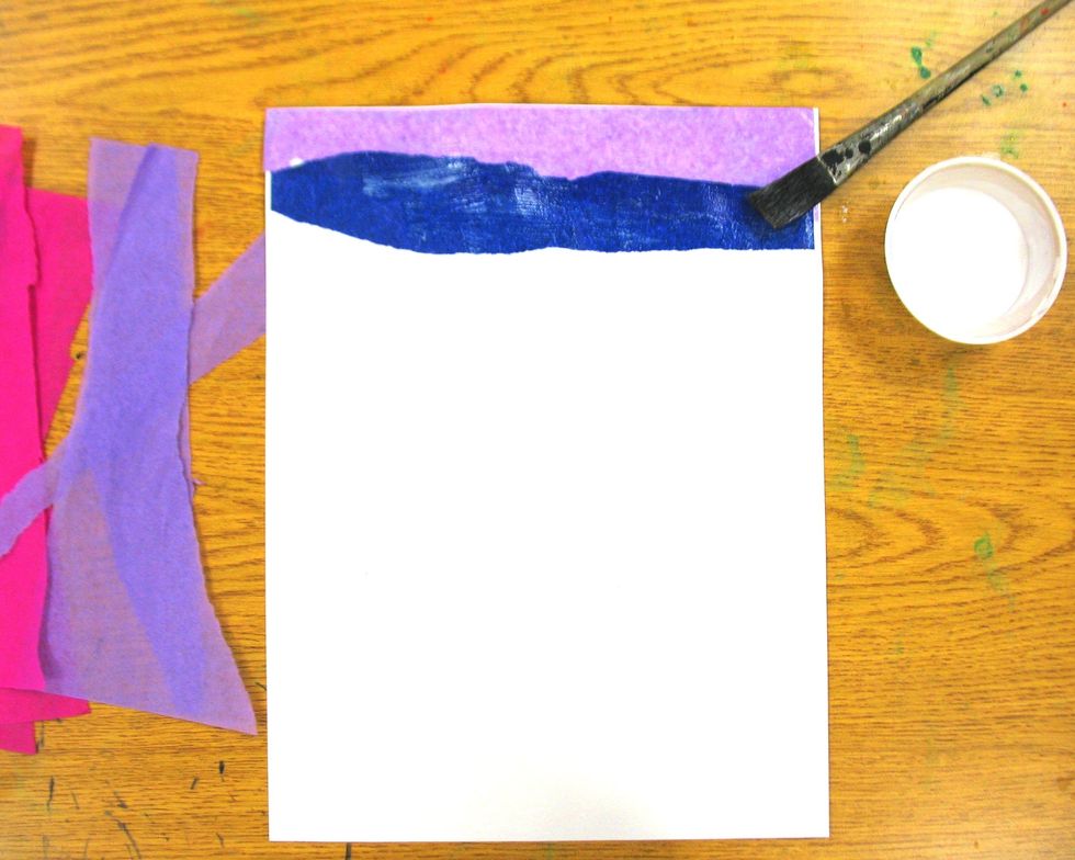 Spread more glue horizontally below your first strip and overlap the next color of tissue paper slightly over the bottom edge of the first strip. Make sure edges are glued and bubbles are smoothed.