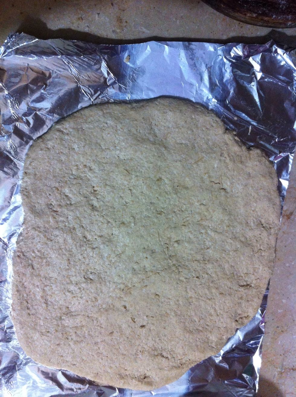 Spread on an aluminum sheet or any baking sheet. Don't forget to oil the sheet before rolling out pizza dough on it