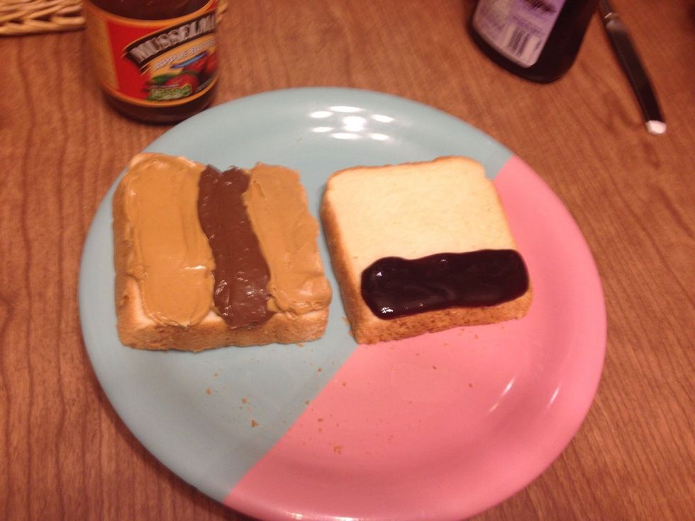 Spread one strip of jelly on one third of the bread horizontally.
