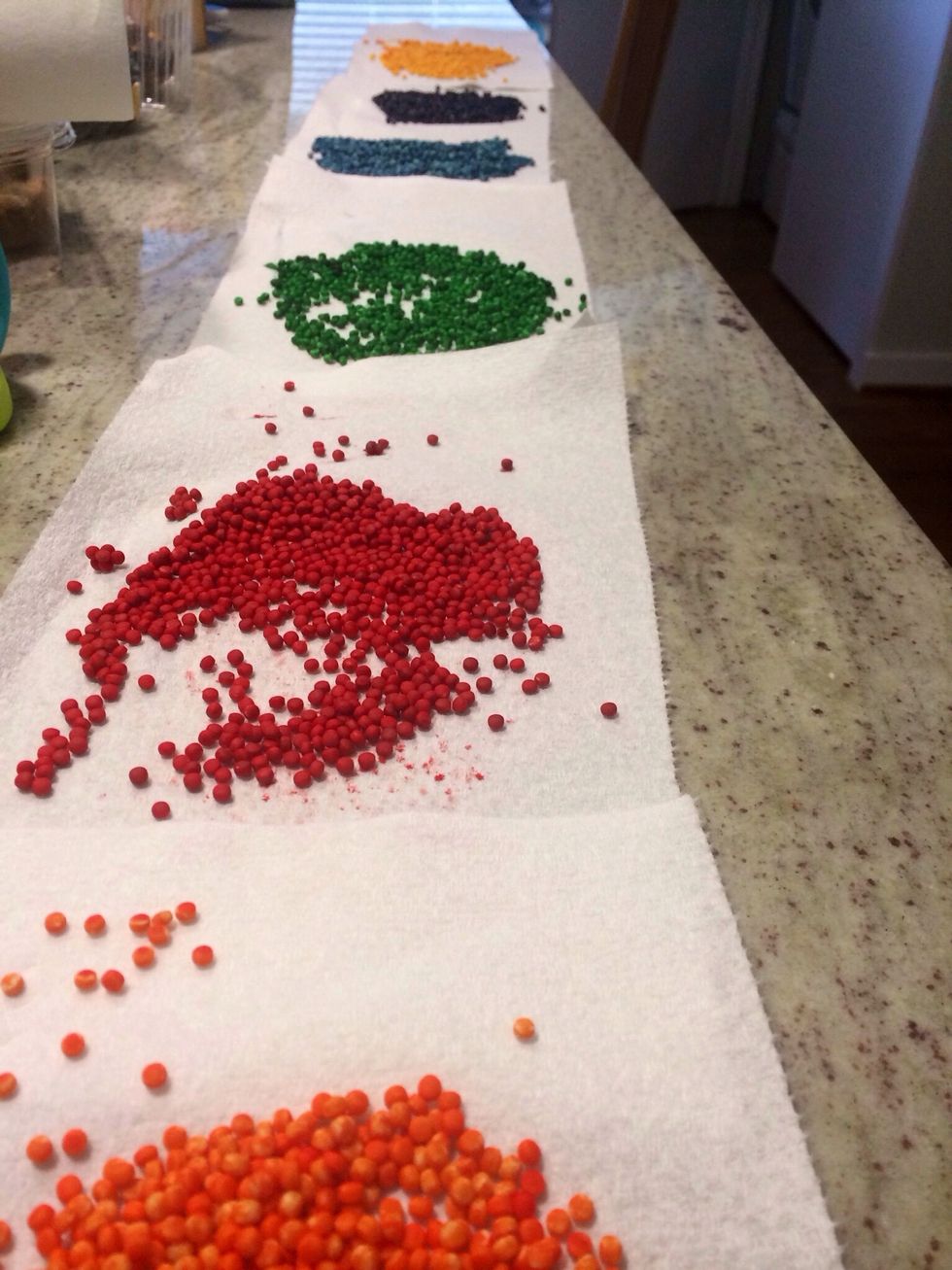 Spread out dyed grains on paper towels and let dry.